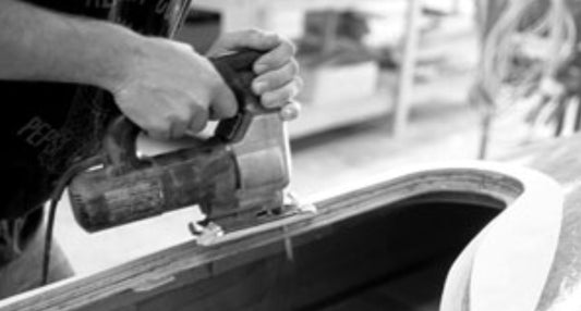 cutting out the coaming on a kayak
