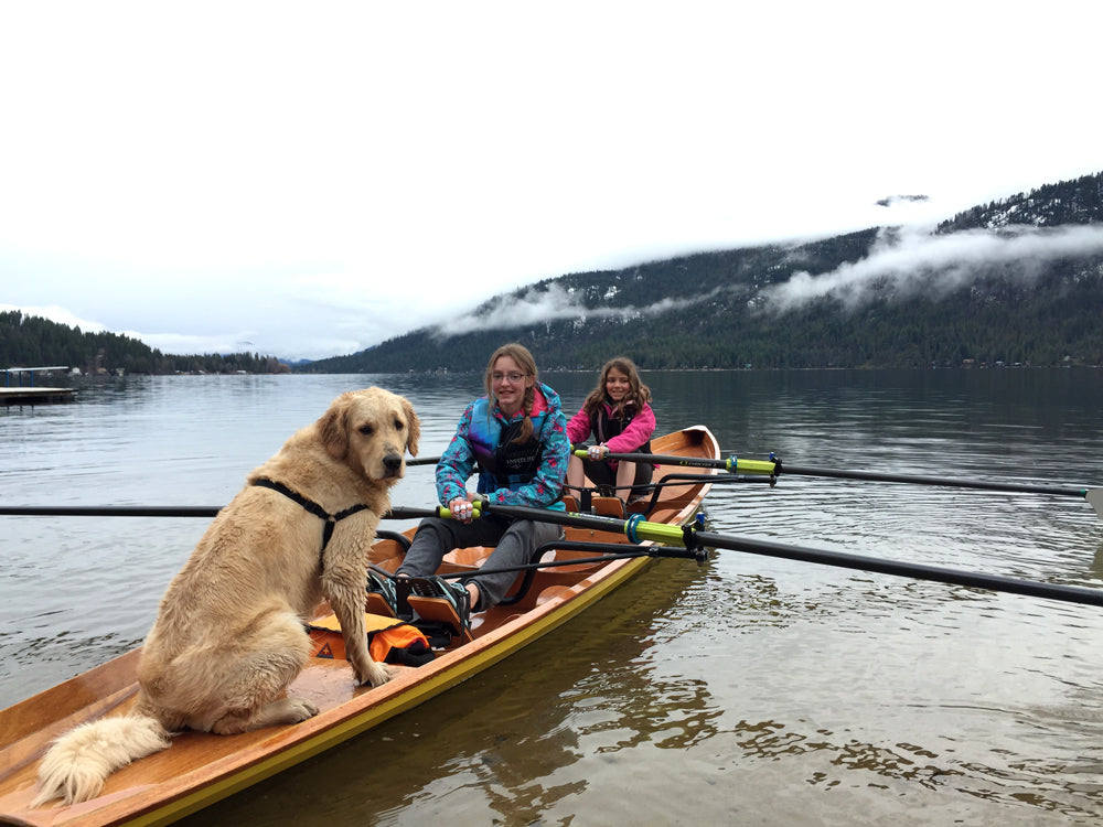 Two girls and a dog rowing an Annapolis Wherry Tandem built by Paul A. on Christina Lake, British Columbia