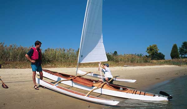 Show Full Screen Attaching the sheet to the boom of a  CLC SailRig