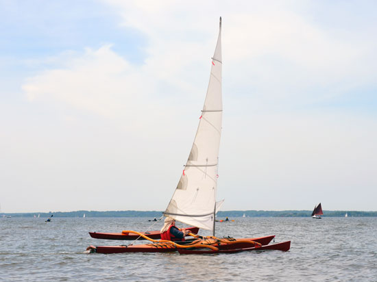 Show Full Screen With hardly any drag, a kayak with a  CLC SailRig glides through the water.