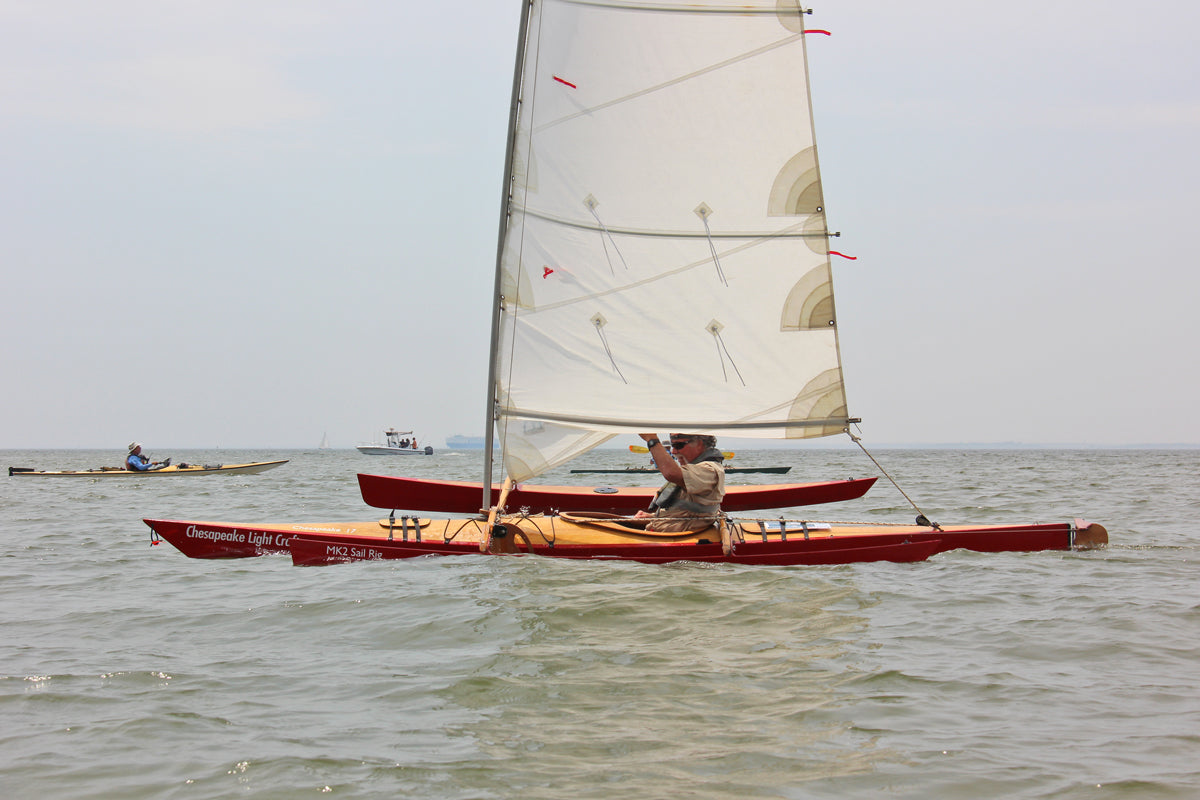 Show Full Screen The leeward ama is almost invisible in this chop as this kayak races along under its CLC SailRig.
