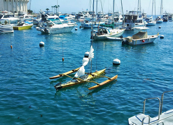 Show Full Screen When on the mooring, the sail of the CLC SailRig can be furled and tied to the boom, as with any sailboat.