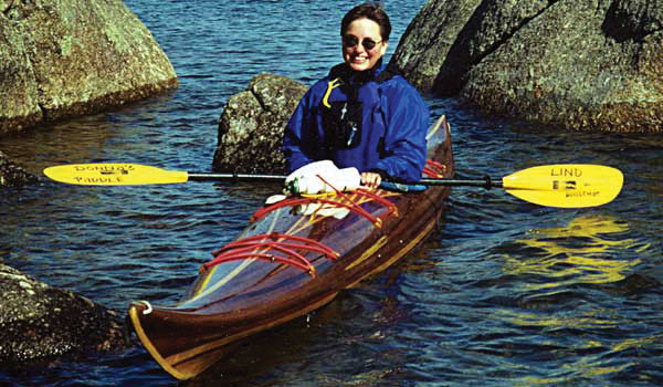 Donna L. paddling her Expedition Single wooden kayak