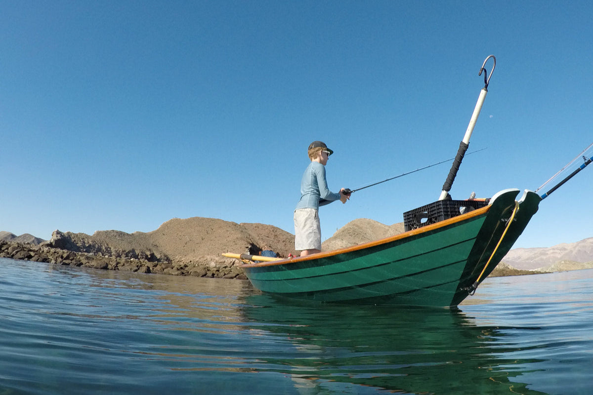 Boy fishing from Northeaster Dory