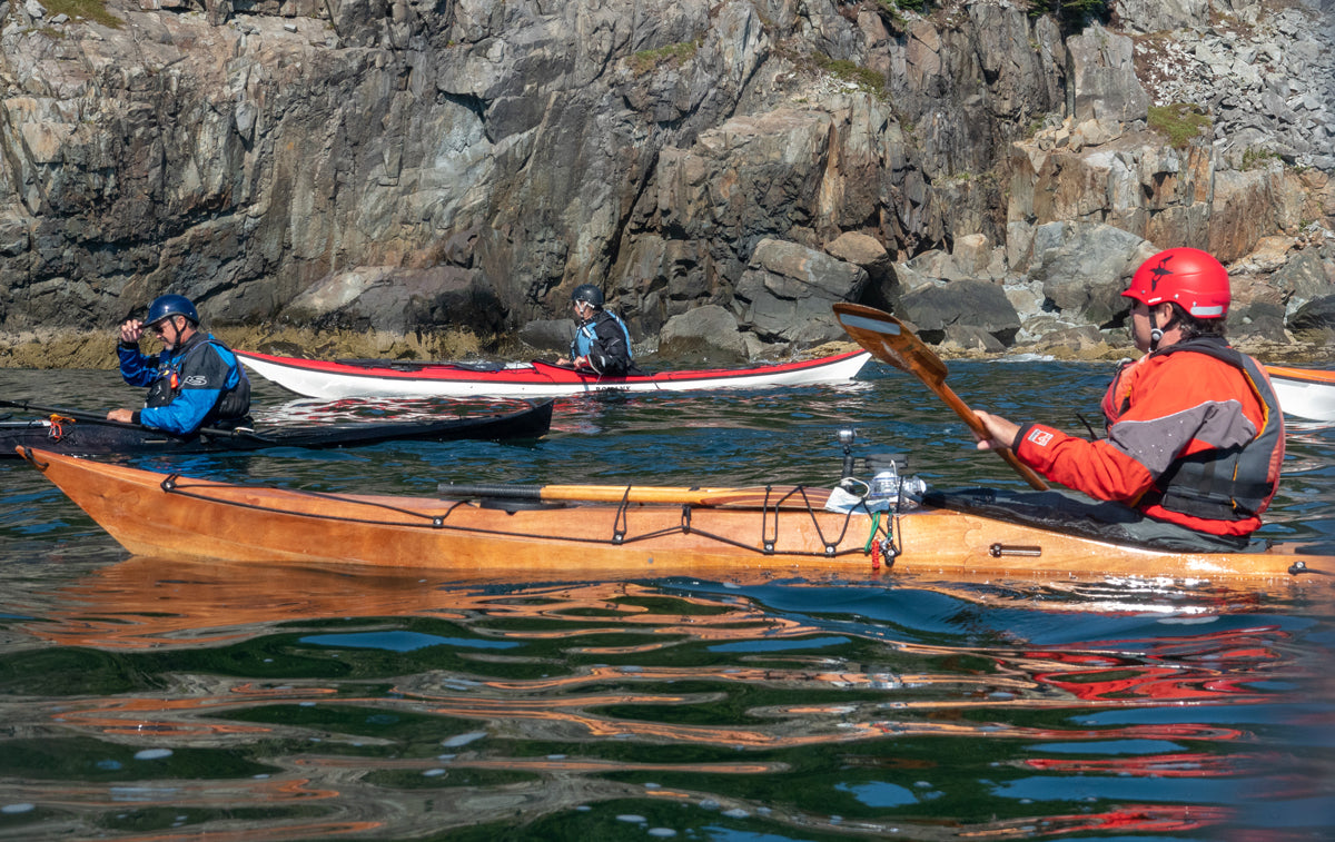Nick Schade paddling his Petrel SG kayak off the rocky coast of Maine's Schoodic Peninsula.