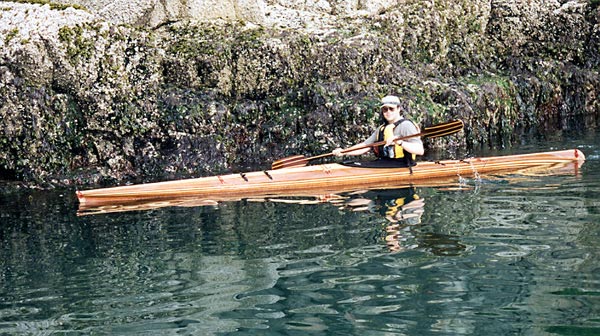 Nick Schade paddling his Aleutesque kayak along the Maine coastline.