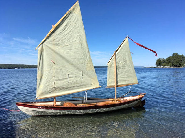 Southwester Dory built by Charles F tethered to the dock awaiting launch.