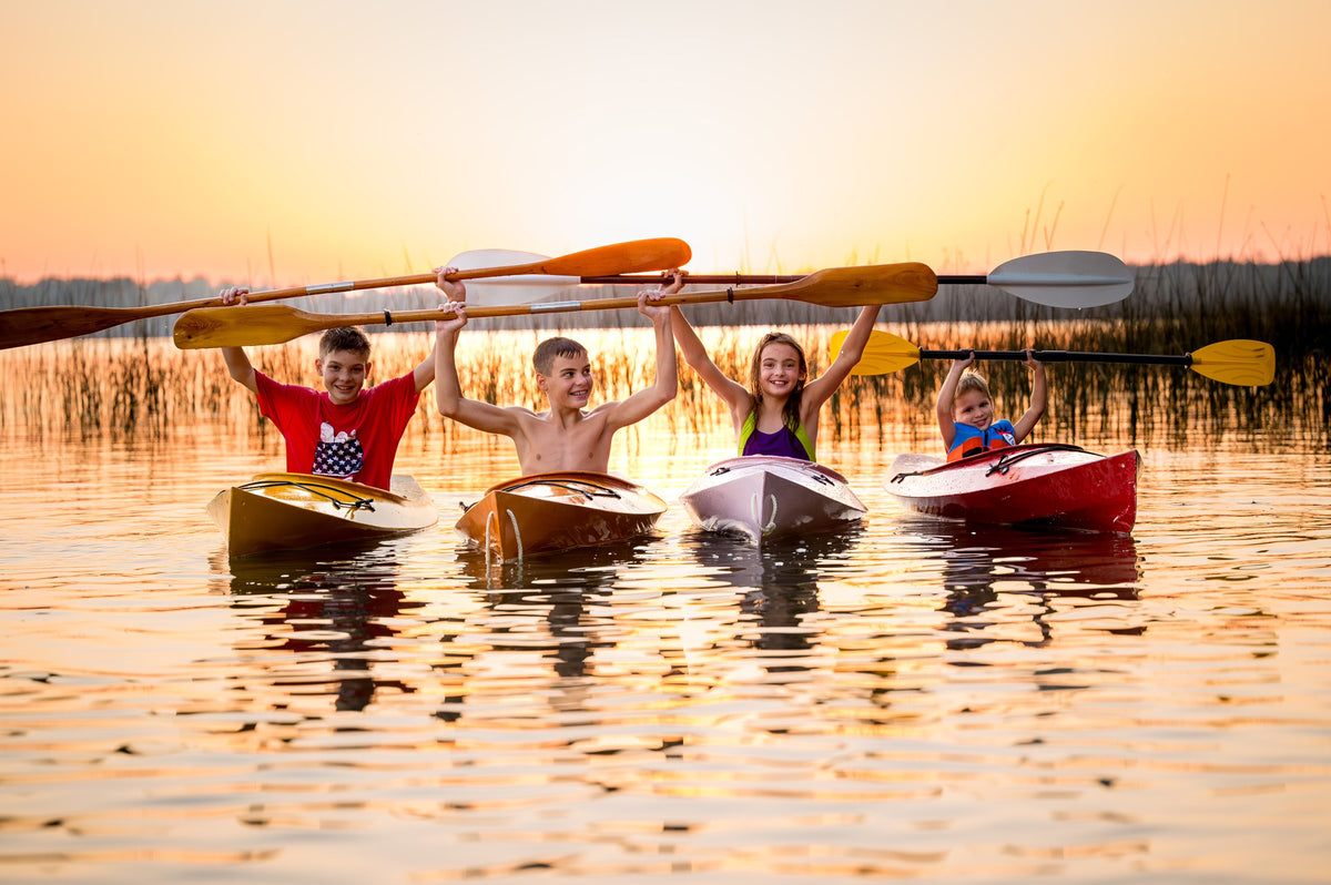 These four paddlers love their Wood Duckling kayaks, built by Grandpa Jim B.