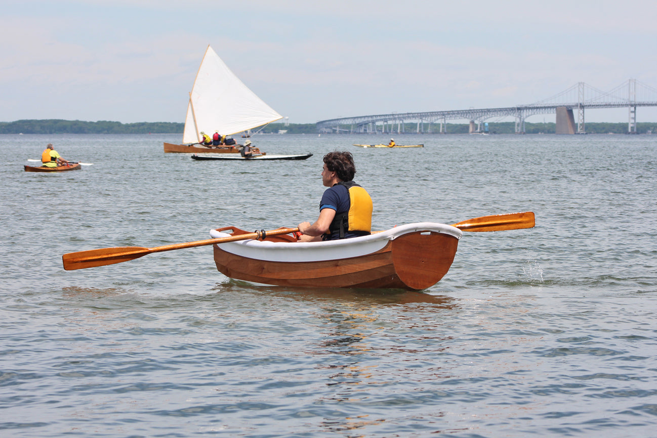 Eastport Ultralight Dinghy being rowed during Okoumefest.