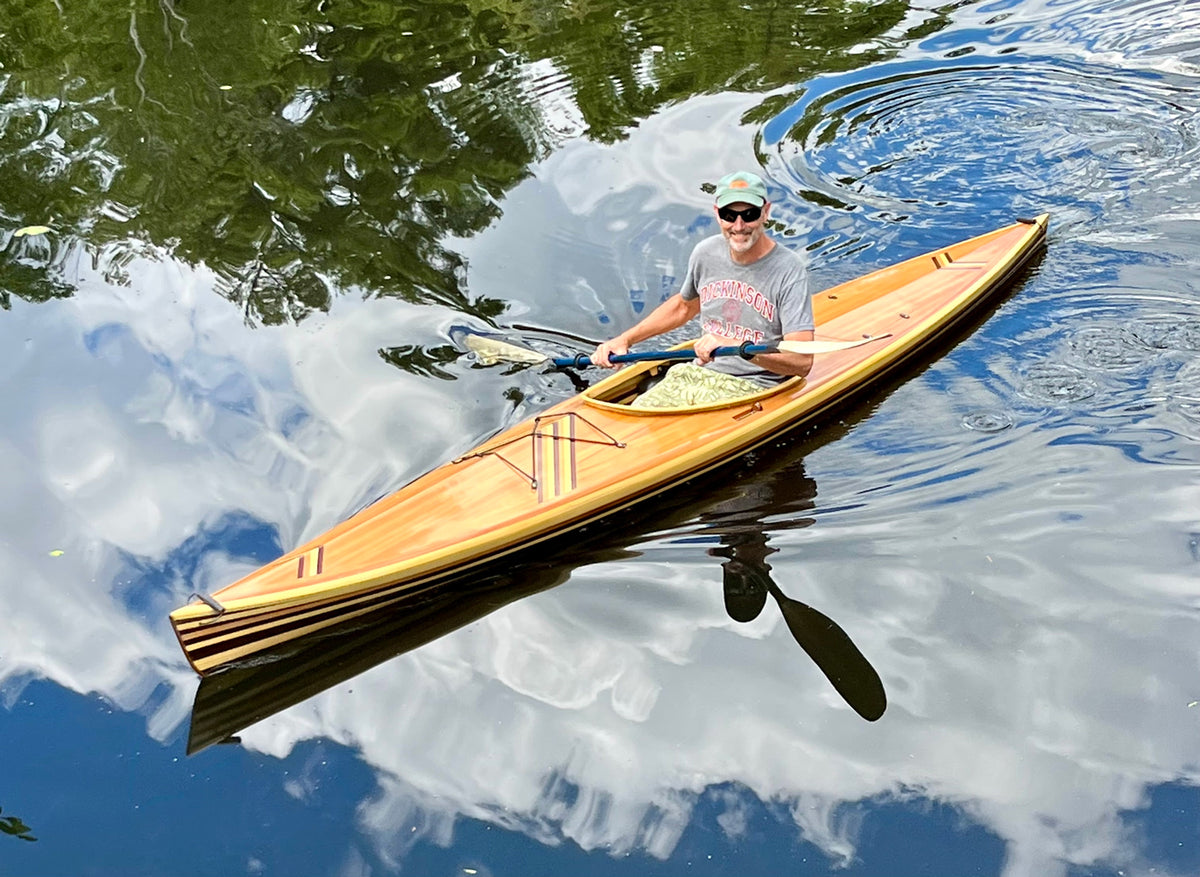 Builder James R. paddling his Great Auk 14 sea kayak on Nequasset Lake, Woolwich, Maine.