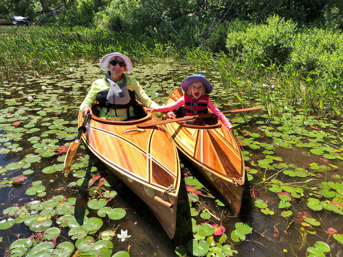 Marji R in her Wood Duck 10 Hybrid kayak beside her granddaughter in command of her Wood Duckling 8 kayak.