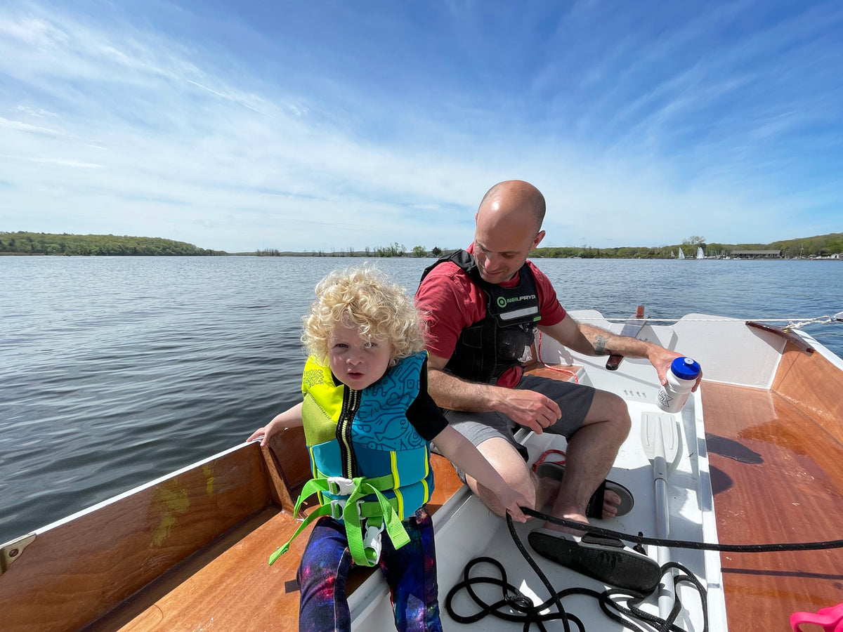 Father and child sailing a CLC Jimmy Skiff.