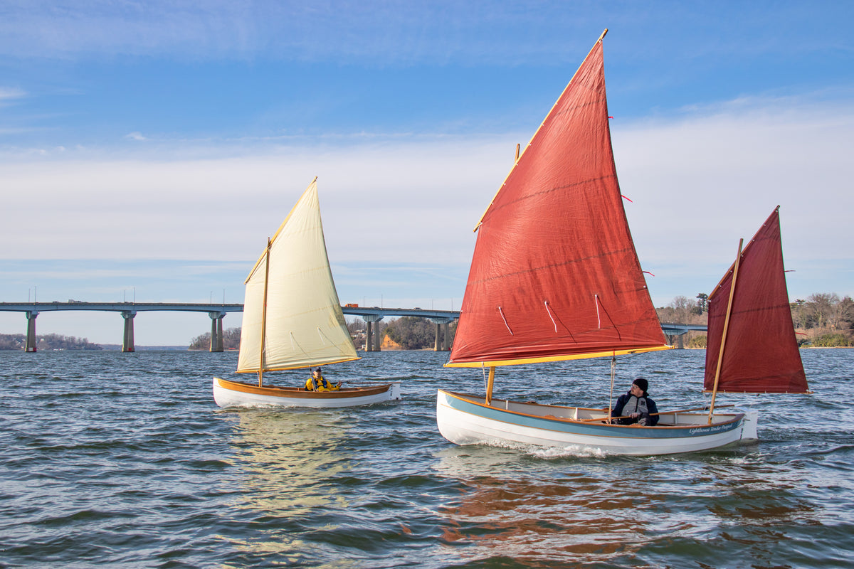 Lighthouse Tender Peapods, Yawl Rig (foreground) & Balanced Lug Rig (background) sailing the Severn River, Annapolis, MD