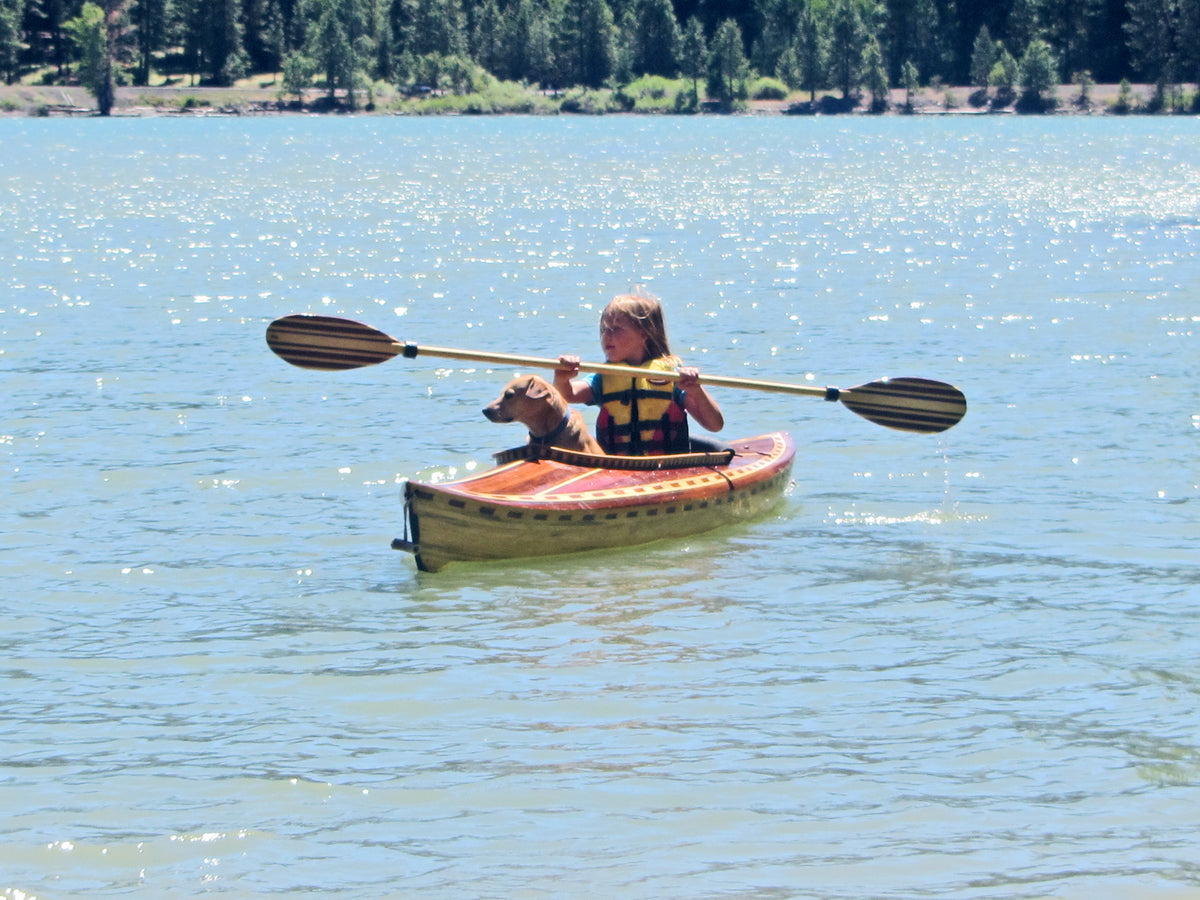 Danica & Tippy paddling a 10' Little Auk built by Tom B.