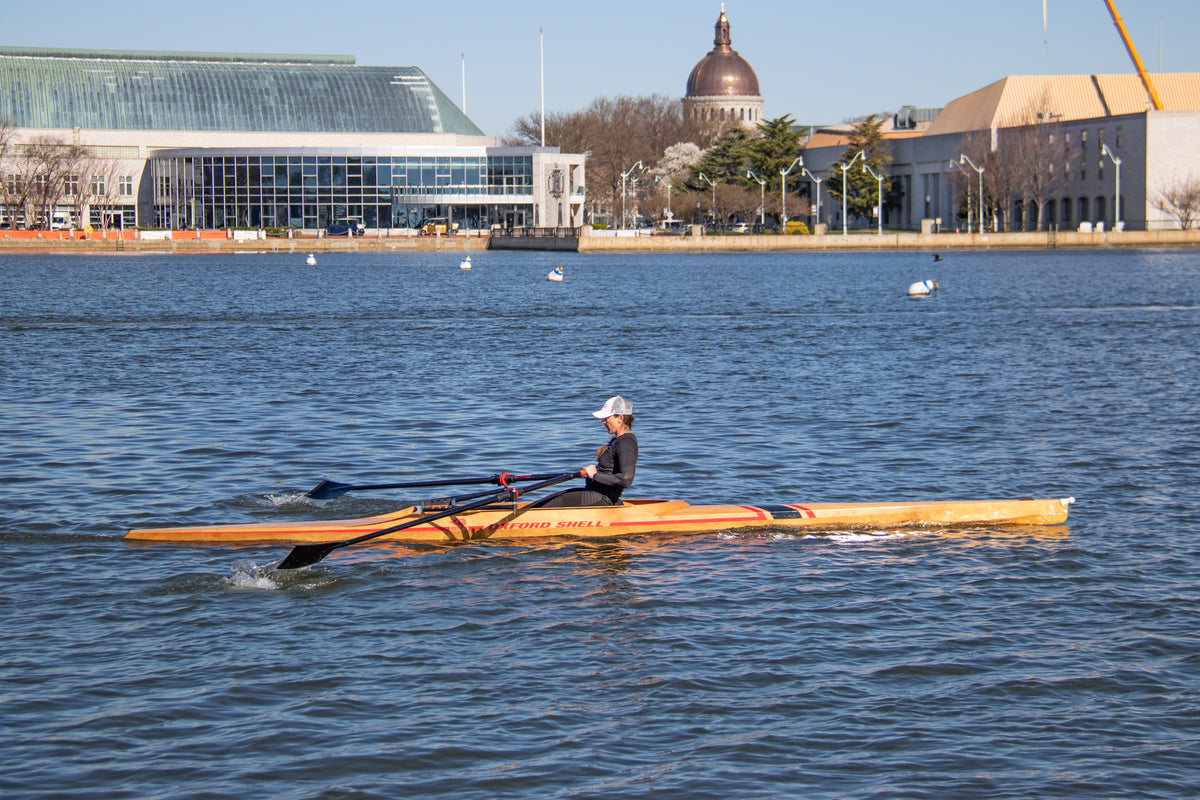 Oxford Shell II being rowed in Maryland's Annapolis Harbor.