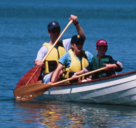 A family paddling their Sassafras 16 canoe