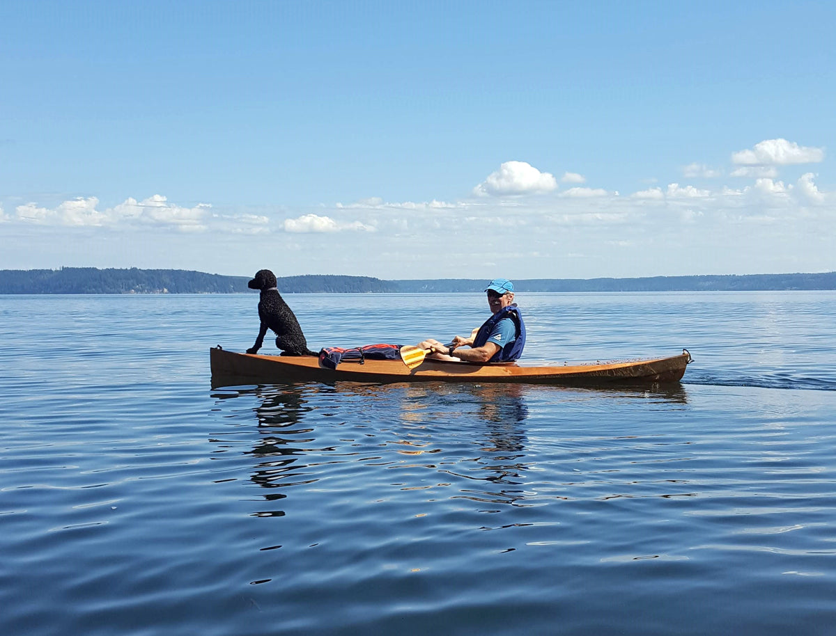 Mike A. paddling the Hood Canal in Washington with his dog, Grace, on the bow.