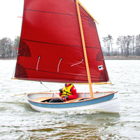 Lighthouse Tender Peapod sailing with a single lug sail.