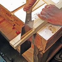Japanese saw cutting a solid piece of timber