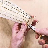 Using modeling plyers to tighten stitching wires