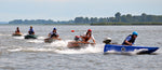 Cocktail Class Racers line up to turn around a buoy on the race course. Thumbnail