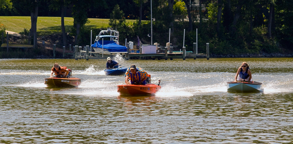 Drivers lean into the turn then straighten out to keep their Cocktail Class racers on plane during one heat in the CCWBRA-Harris Invitational  