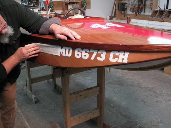 Applying the all important registration number to CLC's Cocktail Class Racer DARK AND STORMY.