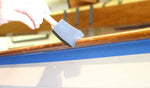 2 inch foam finishing brush used varnishing a wooden rail. Thumbnail