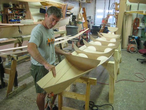 Sewing a plank onto an Annapolis Wherry Tandem boat kit.