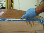 Trimming the fiberglass from the bottom of an Annapolis Wherry Tandem. Thumbnail