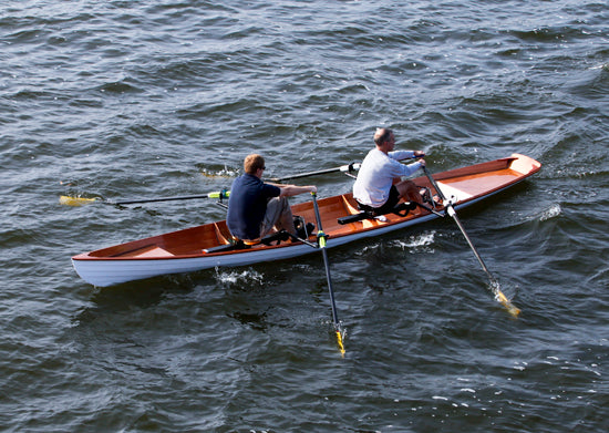 Two men rowing an Annapolis Tandem Wherry