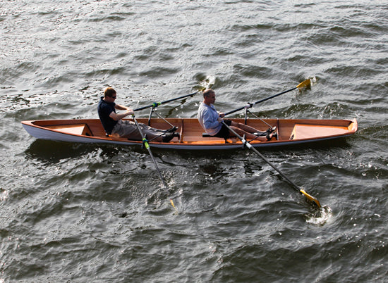 Two men rowing an Annapolis Tandem Wherry