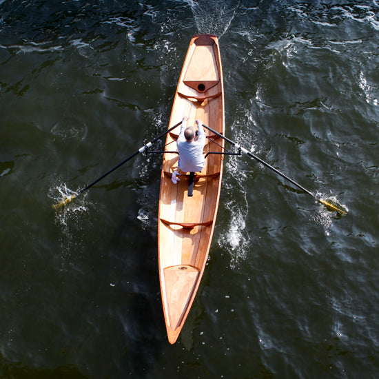 An overhead shot of a single rower in an Annapolis Tandem Wherry