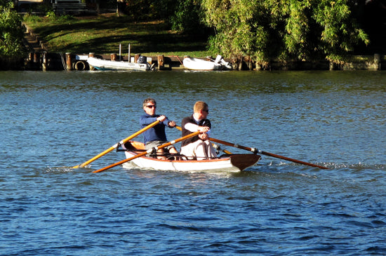 Two men rowing an Annapolis Tandem Wherry