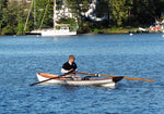 A man rowing an Annapolis Wherry Tandem Thumbnail