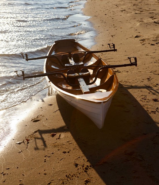 An Annapolis Wherry Tandem pulled up on a beach