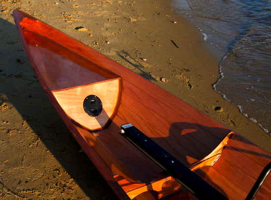 Detail of the bow of an Annapolis Tandem Wherry on a beach
