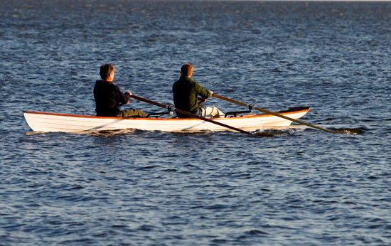 Two men rowing an Annapolis Tandem Wherry