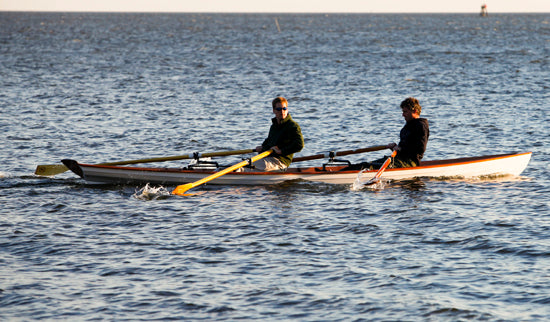 Two men rowing an Annapolis Tandem Wherry