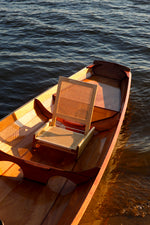 Detail of the stern of an Annapolis Tandem Wherry with cane passenger seat in place. Thumbnail