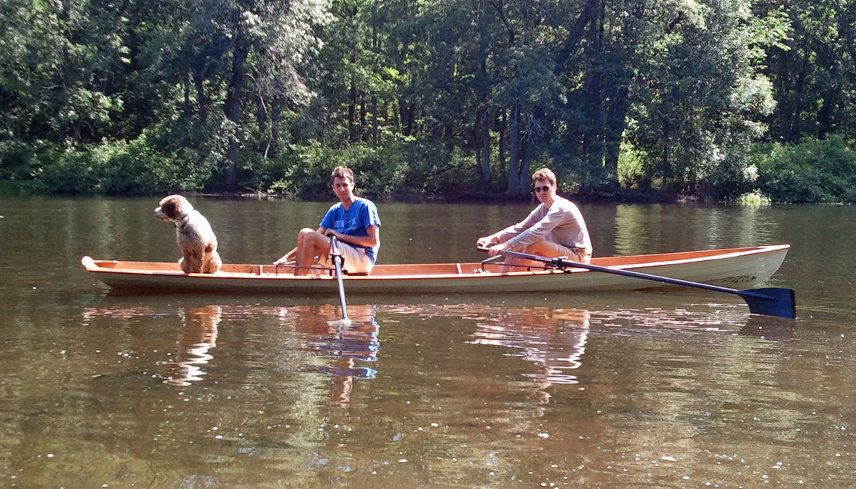 Two men and a dog in an Annapolis Wherry Tandem built by John K.