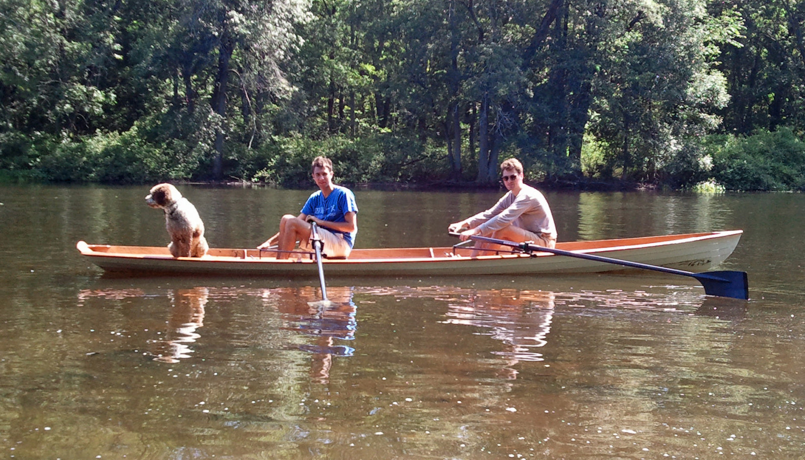 Two men and a dog in an Annapolis Wherry Tandem built by John K.