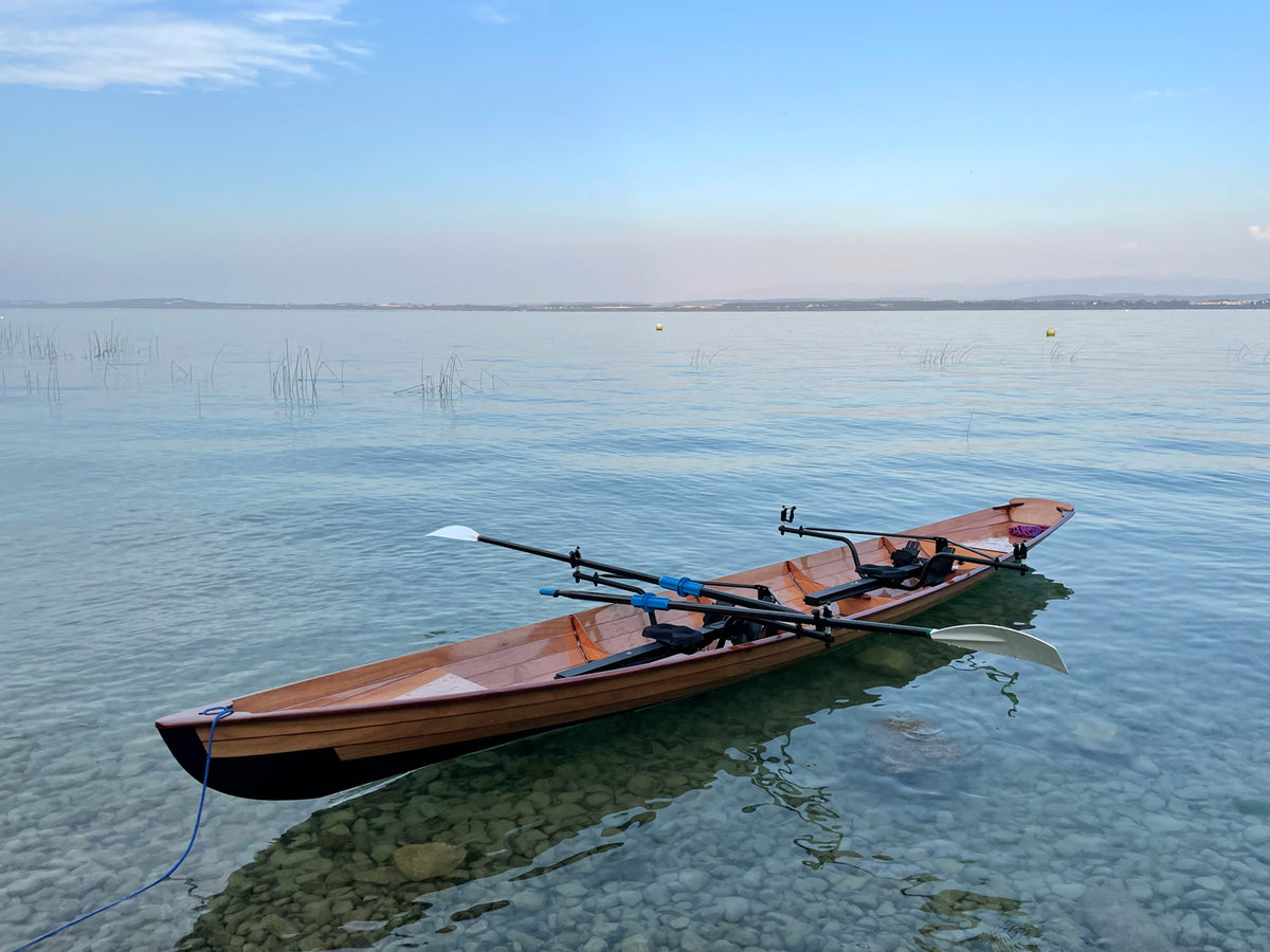 An Annapolis Wherry Tandem built by Olivier M. on clear glassy water of Lake Neuchatel, Switzerland
