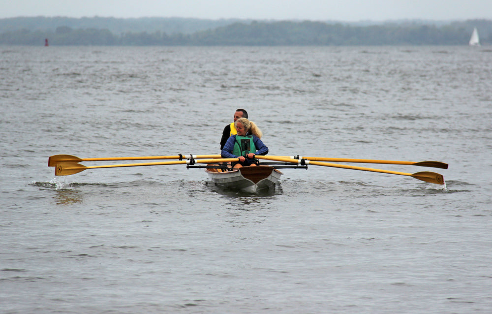 A couple rowing an Annapolis Wherry Tandem at OkoumeFest 2013