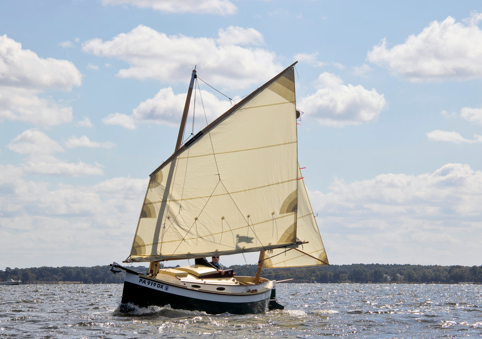 Sailing a lug-rigged Autumn Leaves canoe yawl under partial reef.