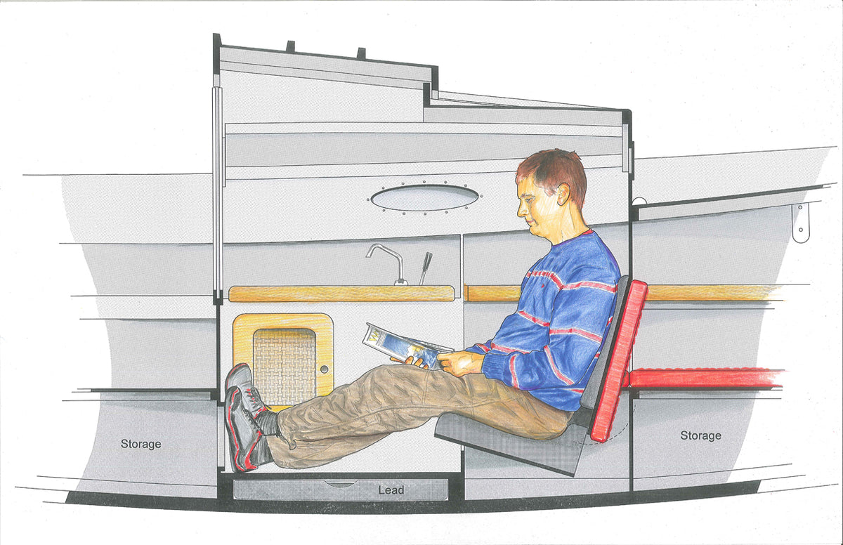 Interior of  Autumn Leaves Canoe yawl, red cushion backrest folds down to form berth that runs astern.
