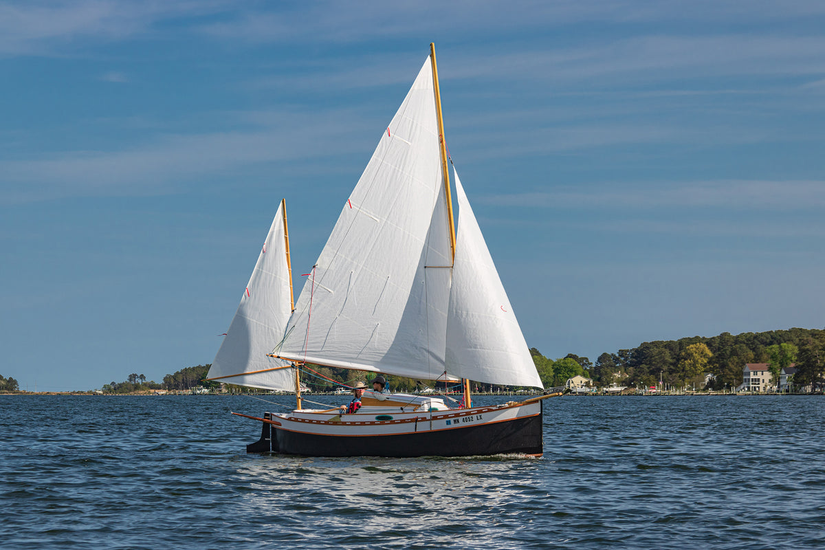 Standard-rigged Autumn Leaves canoe yawl  in a light breeze.