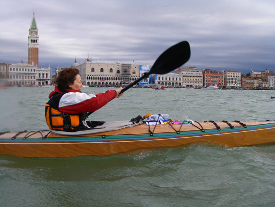 Andrea T. paddling her Chesapeake 16LT wooden kayak in Venice, Italy
