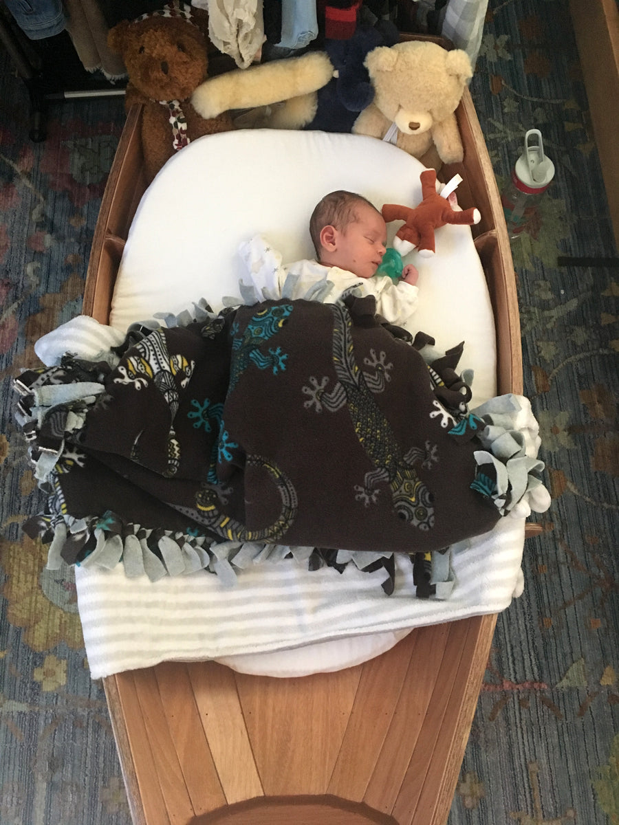 Happiest baby on earth sleeping in a CLC Cradle Boat built by Jeffrey M.