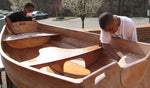 Calverton school students scraping and sanding the finish on their Eastport Pram. Thumbnail
